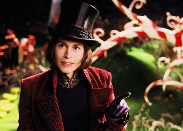 Willy Wonka, a mysterious and eccentric chocolate factory owner who invites five children to his world, in Charlie and the Chocolate Factory (2005).